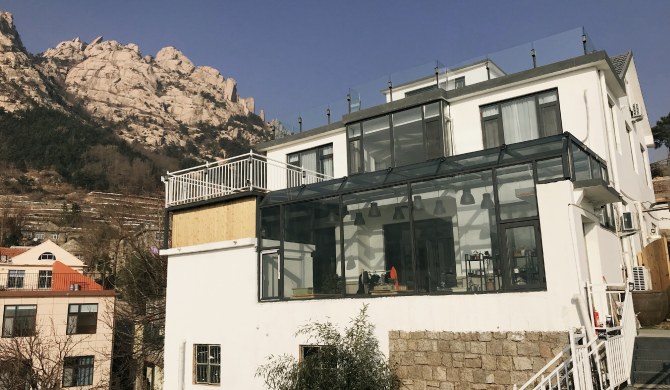 青岛隐居西山民宿崂山仰口雕龙嘴店大床海景